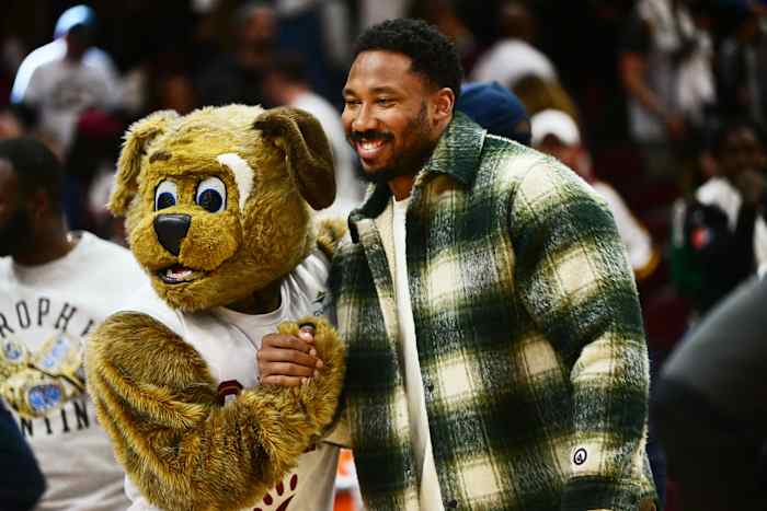Apr 18, 2023; Cleveland, Ohio, USA; Cleveland Browns player Myles Garrett poses for a photo with Cleveland Cavaliers mascot Moondog after the Cavaliers beat the New York Knicks in game two of the 2023 NBA playoffs at Rocket Mortgage FieldHouse.